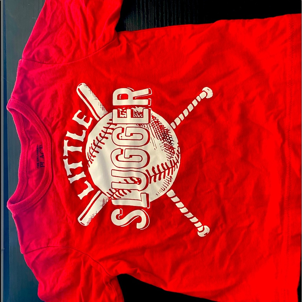 Boys tee shirt with “little slugger” printed on front.